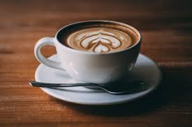 Cappuccino on a dark brown table